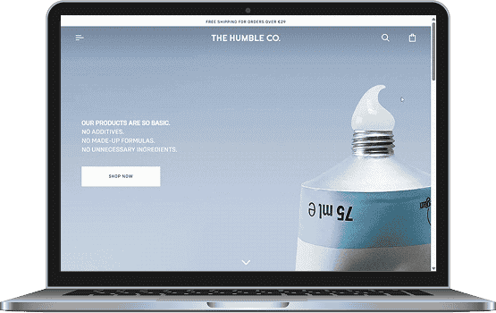 A laptop displaying the improved The Humble Co. website on the screen, highlighting the functional and visual success of the e-commerce redesign and development project.