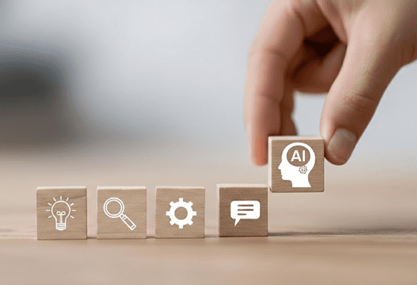 Hand placing AI automation process icons representing business workflow automation