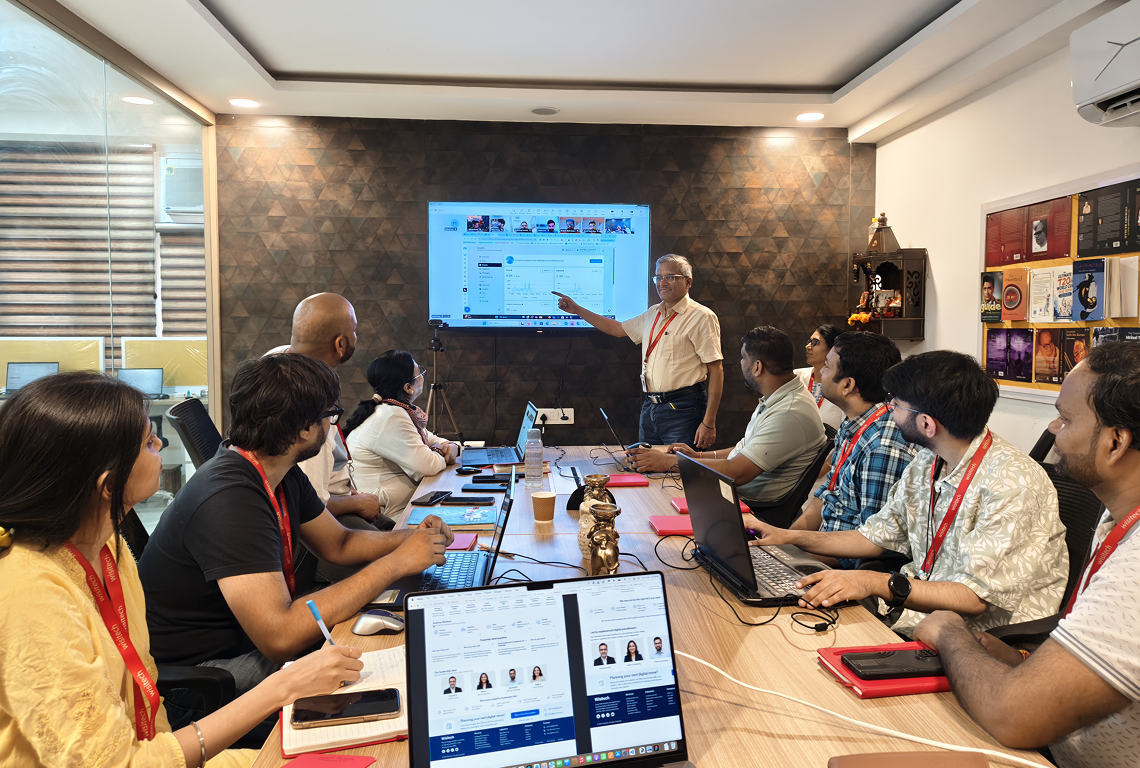 Wisitech team conducting a strategy meeting in the office to discuss digital solutions, website development, and business growth projects.